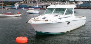 Boat moored to soft mooring buoy